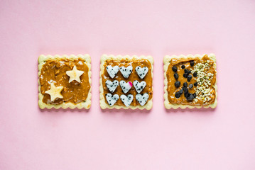 Delicious Toast with peanut butter on the pink background