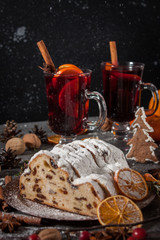 Traditional stollen and milled Hot wine cake and Christmas decorations