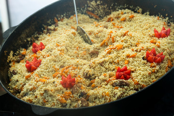 Fried rice with meat and vegetables in pan