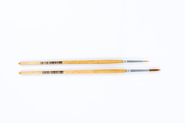 Painting brushes. Drawing tools, paint brushes on white background, copy space, top view