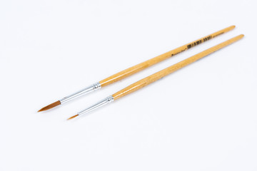 Painting brushes. Drawing tools, paint brushes on white background, copy space, top view