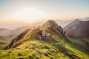 Man trail running on a mountain at the dask