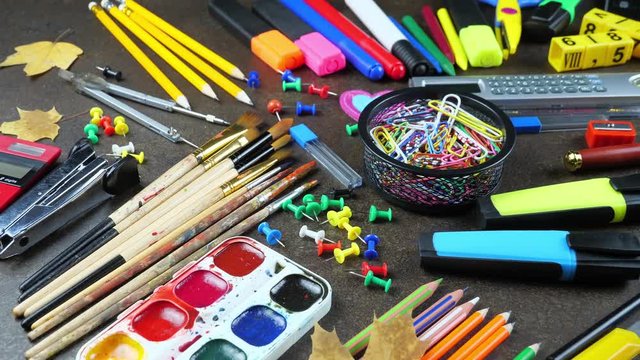 Back to school. School subjects for study, rotate on the table. - Powered by Adobe