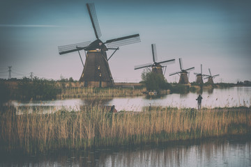 Amazing nature, scenic vintage landscape with windmills, sky and water. Traditional dutch...