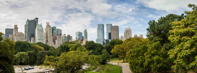Large panoramic view from Central Park to Manhattan skyscrapers at sunny day. New York City