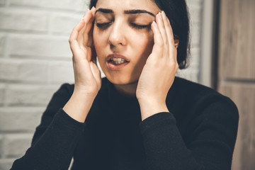 young sad woman hand in head