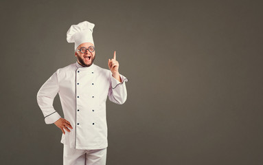 Funny cheerful chef in white uniform on background for text.