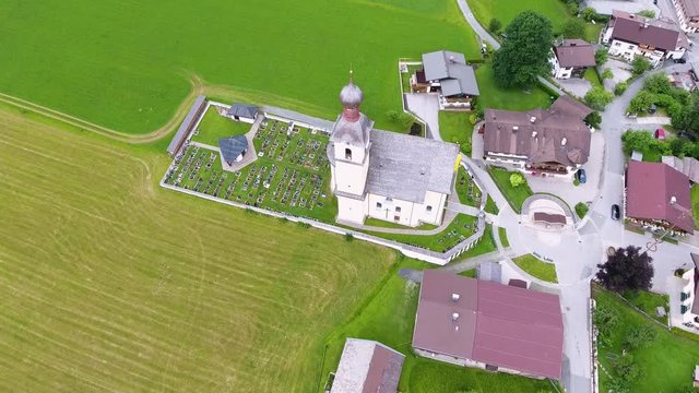 AERIAL - Flight with the DJI Phantom 4 in Going at the Wilder Kaiser. Filming location of the TV series "Der Bergdoktor"