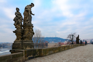 Fototapeta premium Sculptural compositions of Charles Bridge, Prague, Czech Republic. Saint Ivo, church judge of Franciscan Order