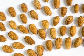 handful of almonds on white background