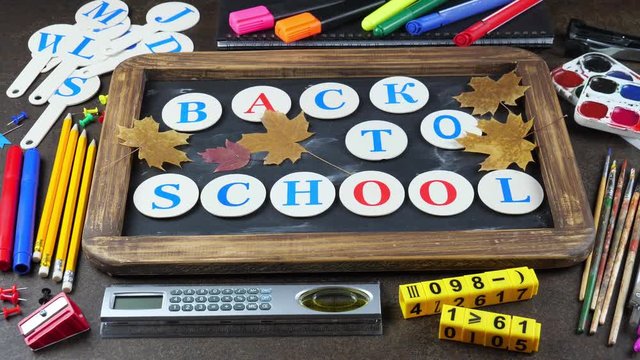 Back to school. Items for school activities rotate on the table.
