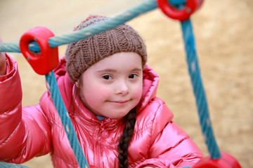 Portrait of beautiful girl on the playground