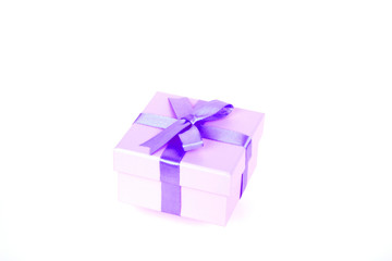 gift box with purple bow and white background