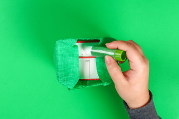 DIY leprechaun trap with gold coins,  rainbow and green ladder St Patricks Day background.