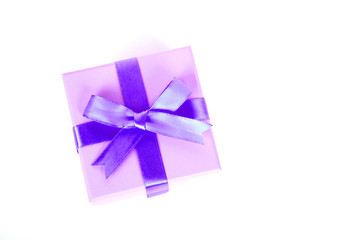gift box with purple bow and white background