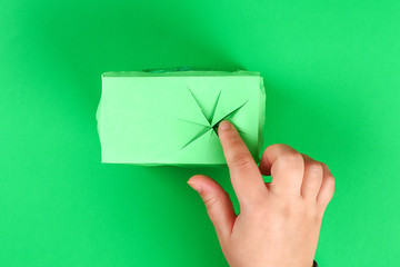 DIY leprechaun trap with gold coins,  rainbow and green ladder St Patricks Day background.