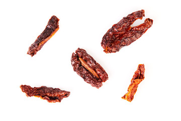 Sun dried tomatoes close up macro isolated on white background