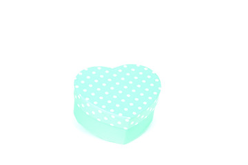 green gift box with white polka dots and heart shape on white background 