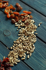 Sunflower seeds on a blue wooden background