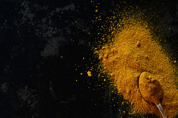Garam masala powder on a black background