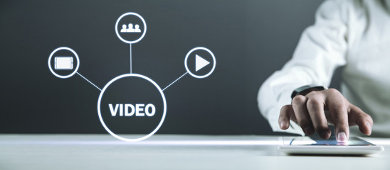 Man holding tablet with Video sign. Video marketin