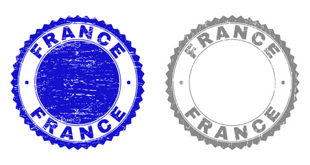 Grunge FRANCE watermarks isolated on a white background. Rosette seals with grunge texture in blue and gray colors. Vector rubber stamp imprint of FRANCE title inside round rosette.