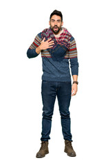 Fototapeta premium Full-length shot of Hippie man surprised and shocked while looking right on isolated white background
