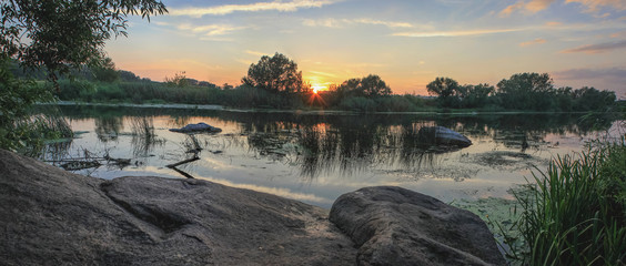 summer landscape on the banks of the  river at sunset at Ukraine