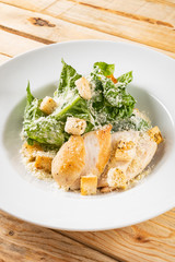 fresh caesar salad in the white plate