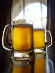 Two Glasses Of Cold Craft Beer Isolated On Table  
