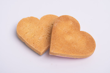 valentine Decorated heart shaped cookies on white background.