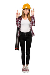 A full-length shot of a Architect woman with fingers crossing and wishing the best over isolated white background