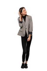 A full-length shot of a Business woman thinking an idea while scratching head over isolated white background