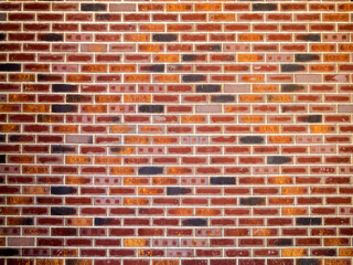 Fototapeta na wymiar The texture of clinker bricks on the walls. Background