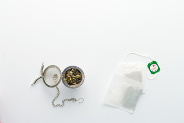 Fototapeta na wymiar concept of drinking tea without plastic single use teabag. reusable metalic infuser
