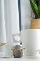 concept of drinking tea without plastic single use teabag. reusable  metalic infuser