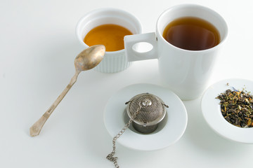 Obraz na płótnie Canvas concept of drinking tea without plastic single use teabag. reusable metalic infuser