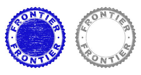 Grunge FRONTIER stamp seals isolated on a white background. Rosette seals with grunge texture in blue and grey colors. Vector rubber stamp imitation of FRONTIER tag inside round rosette.