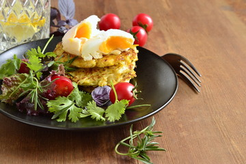 Pancakes with zucchini, eggs and vegetables, healthy breakfast, copy space