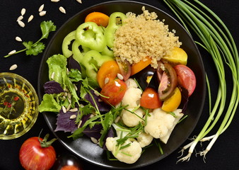 Vegetarian salad with quinoa, vegetables and sunflower seeds. Buddha bowl, top view