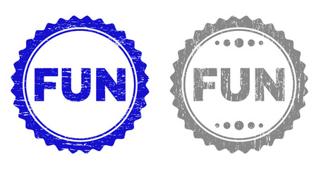 Grunge FUN stamp seals isolated on a white background. Rosette seals with grunge texture in blue and gray colors. Vector rubber overlay of FUN caption inside round rosette.