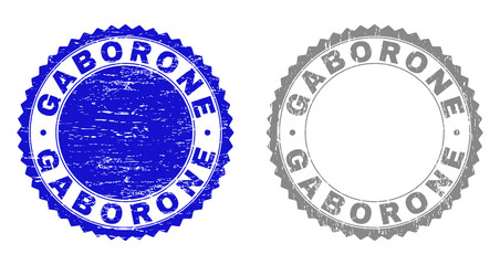 Grunge GABORONE stamp seals isolated on a white background. Rosette seals with grunge texture in blue and grey colors. Vector rubber stamp imprint of GABORONE tag inside round rosette.
