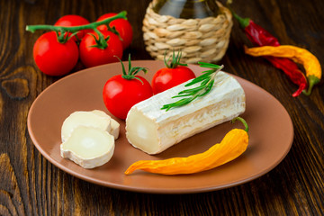Graviera greek cheese on clay plate.