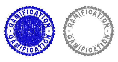 Grunge GAMIFICATION stamp seals isolated on a white background. Rosette seals with grunge texture in blue and gray colors. Vector rubber watermark of GAMIFICATION title inside round rosette.
