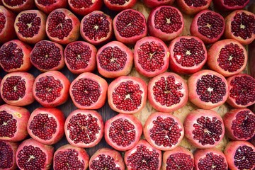 Full frame of peeled fresh pomegranates. Background organic pomegranate fruit.