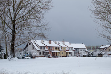 Fototapeta na wymiar Fabulously beautiful snow-covered houses, streets and roads in the snow, winter snowfall, snow drifts