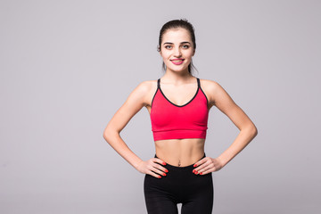 Fototapeta na wymiar Portrait of smiling fitness young woman isolated on white background