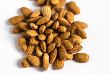 handful of almonds on white background the nuts
