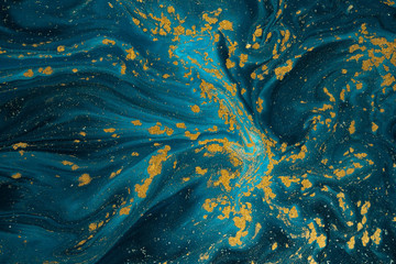 Naklejka na ściany i meble Abstract paint texture art. Natural luxury. Blue paint with gold glitter powder. Marble background.