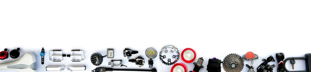 Bicycle parts and accessories on a white background. - obrazy, fototapety, plakaty